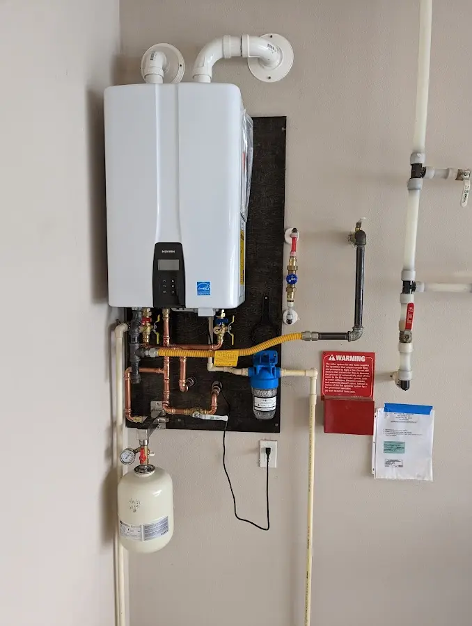 Professional plumber installing copper piping in a Ellenville home